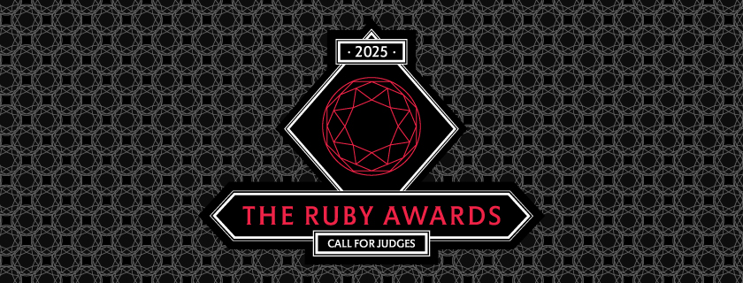 A dark banner with a geometric pattern background and the logo of the Ruby awards int the centre with the same pattern.
